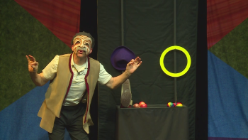 Doug performing in a mask